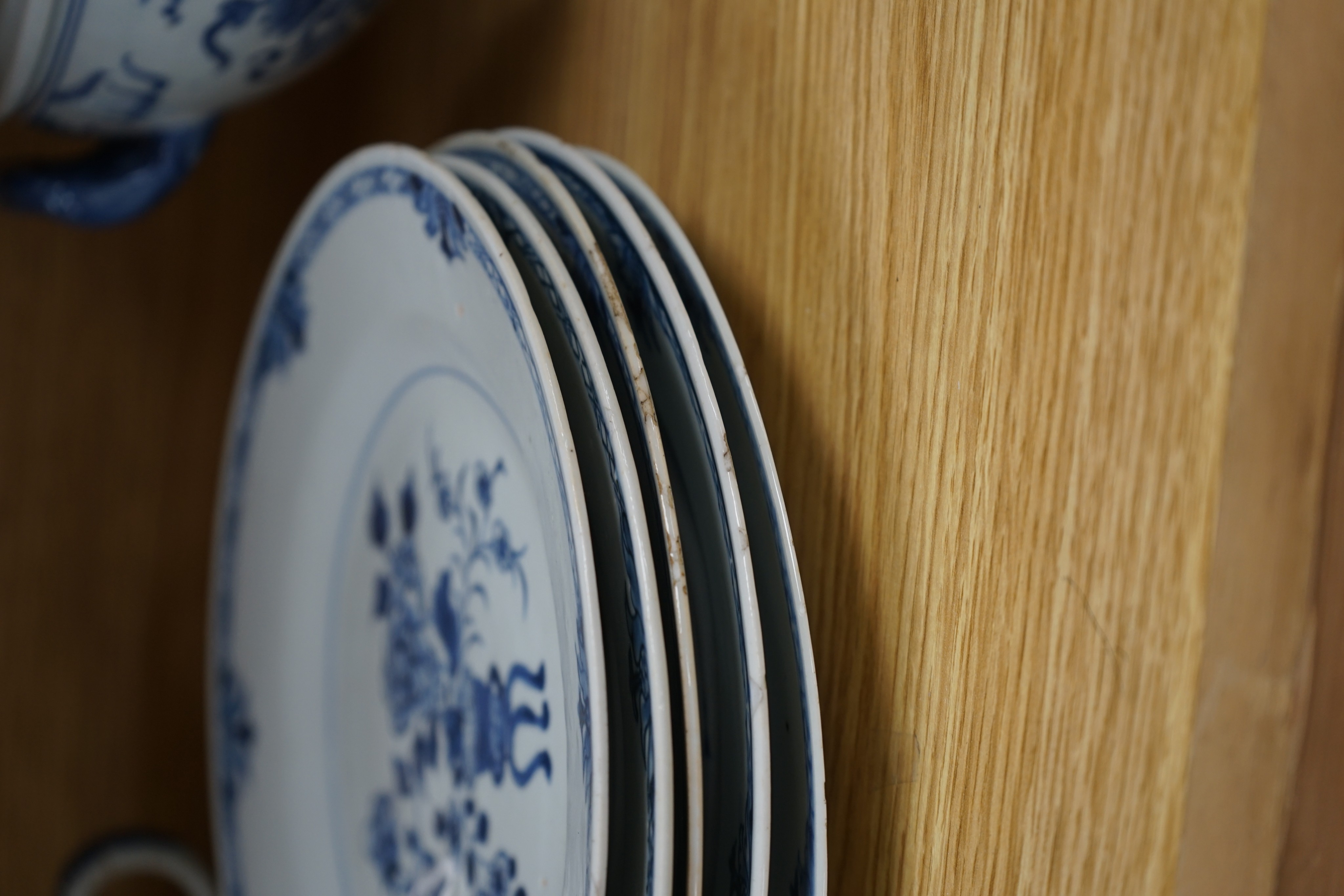 An 18th century Chinese Export blue and white octagonal tureen and cover, decorated with birds and flowers, a pair of similar sauceboats and five plates decorated with urns of flowers